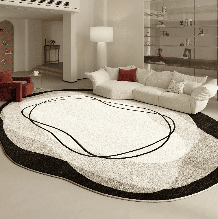 Tapis salon moderne 160x230 au design abstrait noir et blanc installé dans un salon contemporain élégant et haut de gamme.