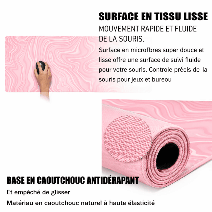 Base en caoutchouc antidérapant du tapis de souris rose XXL assurant stabilité et maintien parfait.