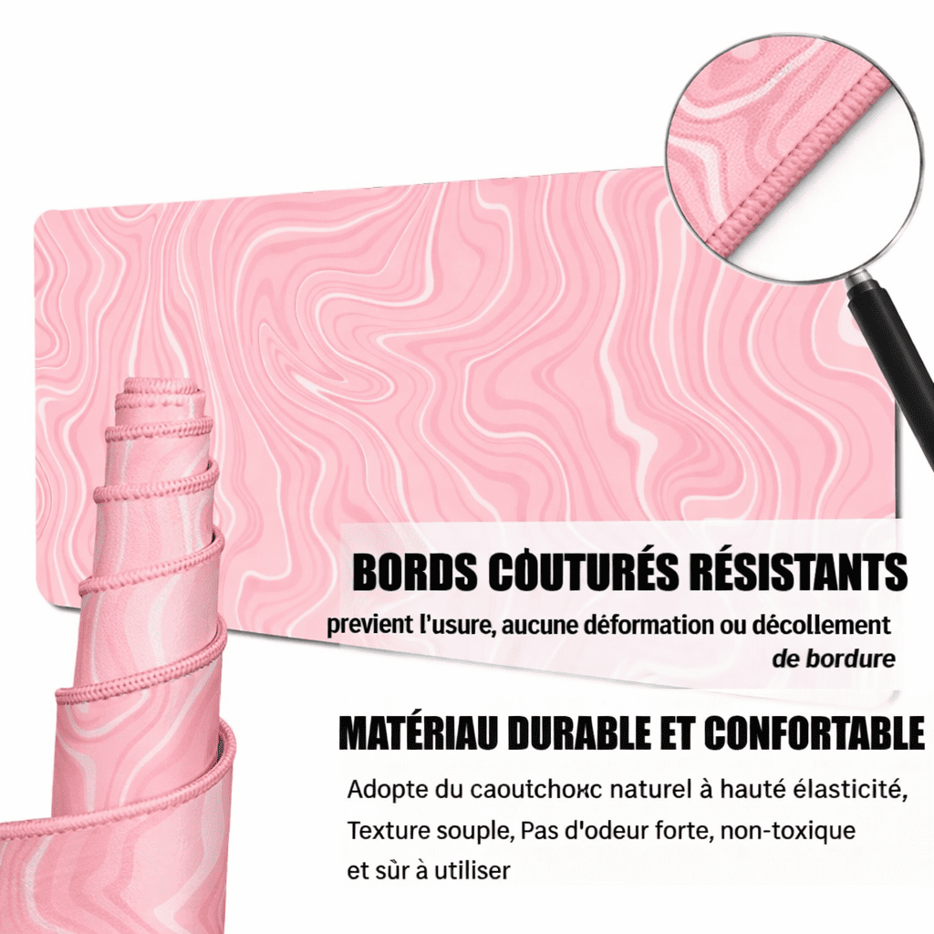 Détail des bords renforcés du tapis de souris rose grand format pour une meilleure durabilité.