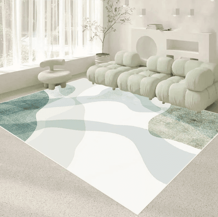 tapis salon 160×230 cm à motif abstrait pastel vert clair et bleu ciel sur fond blanc, sous un canapé modulable dans un intérieur lumineux.