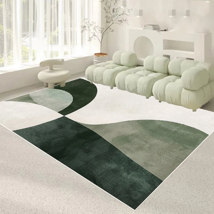 Tapis salon 160×230 cm à motif de cercles verts foncés et clairs sur fond crème, posé sous un canapé modulable dans un salon lumineux.